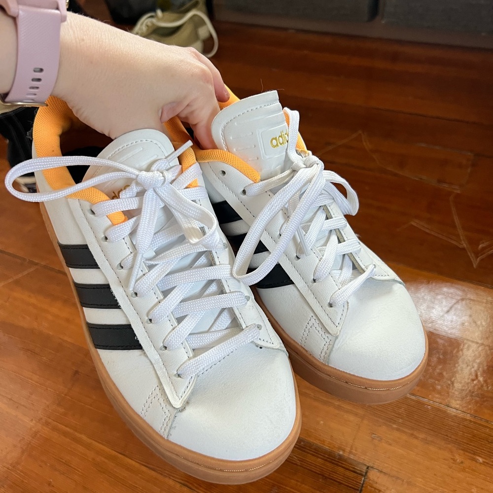 Adidas Sneakers with White, Black, and Orange Highlights